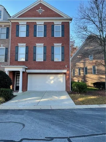 a front view of a house with yard