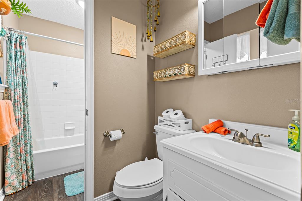 1040 Jocelin Road Pensacola, FL 32506 - Photo 23 of 46 a white toilet sitting next to a bathroom sink