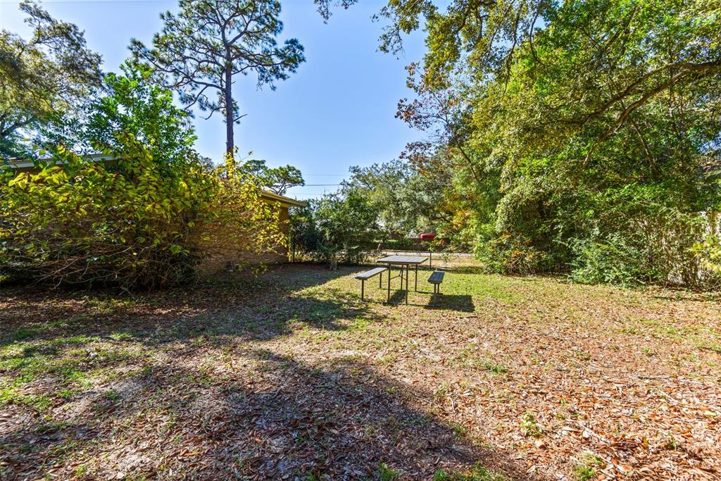 1040 Jocelin Road Pensacola, FL 32506 - Photo 31 of 46 a view of a yard with a house in the background