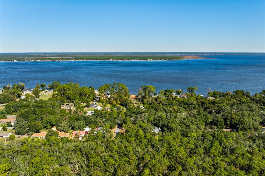 1040 Jocelin Road Pensacola, FL 32506 - Photo 41 of 46 a view of a green field with lots of bushes