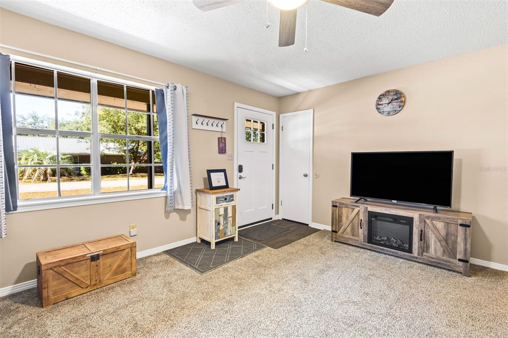 1040 Jocelin Road Pensacola, FL 32506 - Photo 9 of 46 a living room with furniture and a flat screen tv