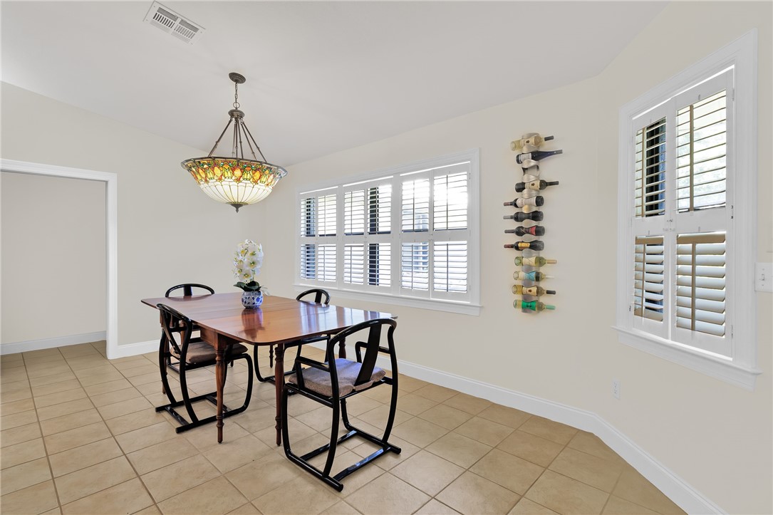 380 Bayfront Terrace Sebastian, FL 32958 - Photo 16 of 32 a view of a dining room with furniture and chandelier