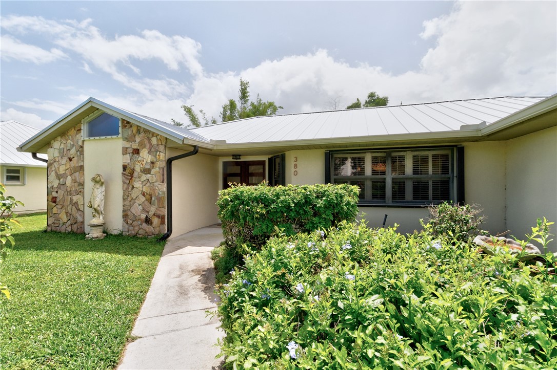 380 Bayfront Terrace Sebastian, FL 32958 - Photo 2 of 32 a front view of a house with a garden