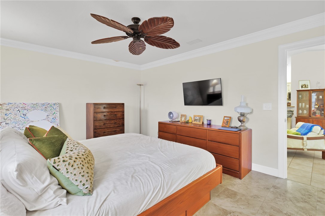 380 Bayfront Terrace Sebastian, FL 32958 - Photo 22 of 32 a bedroom with a bed and a flat screen tv
