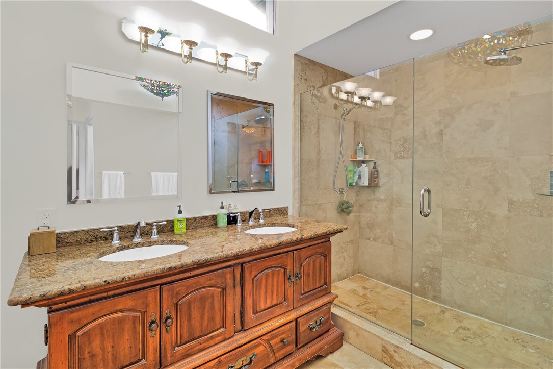 380 Bayfront Terrace Sebastian, FL 32958 - Photo 23 of 32 a bathroom with a granite countertop double vanity sink mirror and shower