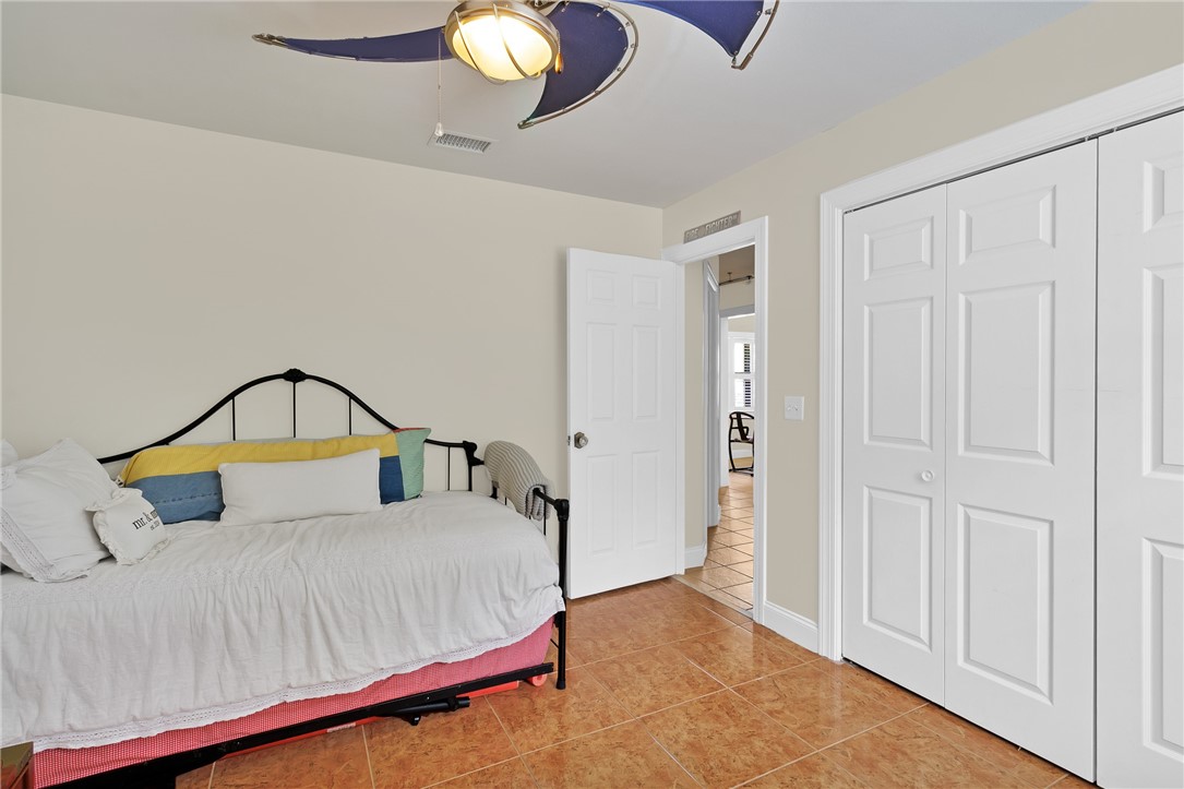 380 Bayfront Terrace Sebastian, FL 32958 - Photo 26 of 32 a bedroom with a bed and a window