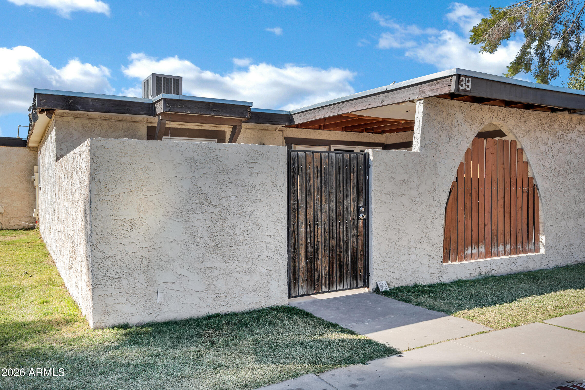 720 South Dobson Road, Unit 39 Mesa, AZ 85202 - Photo 2 of 13 a view of a back yard of the house