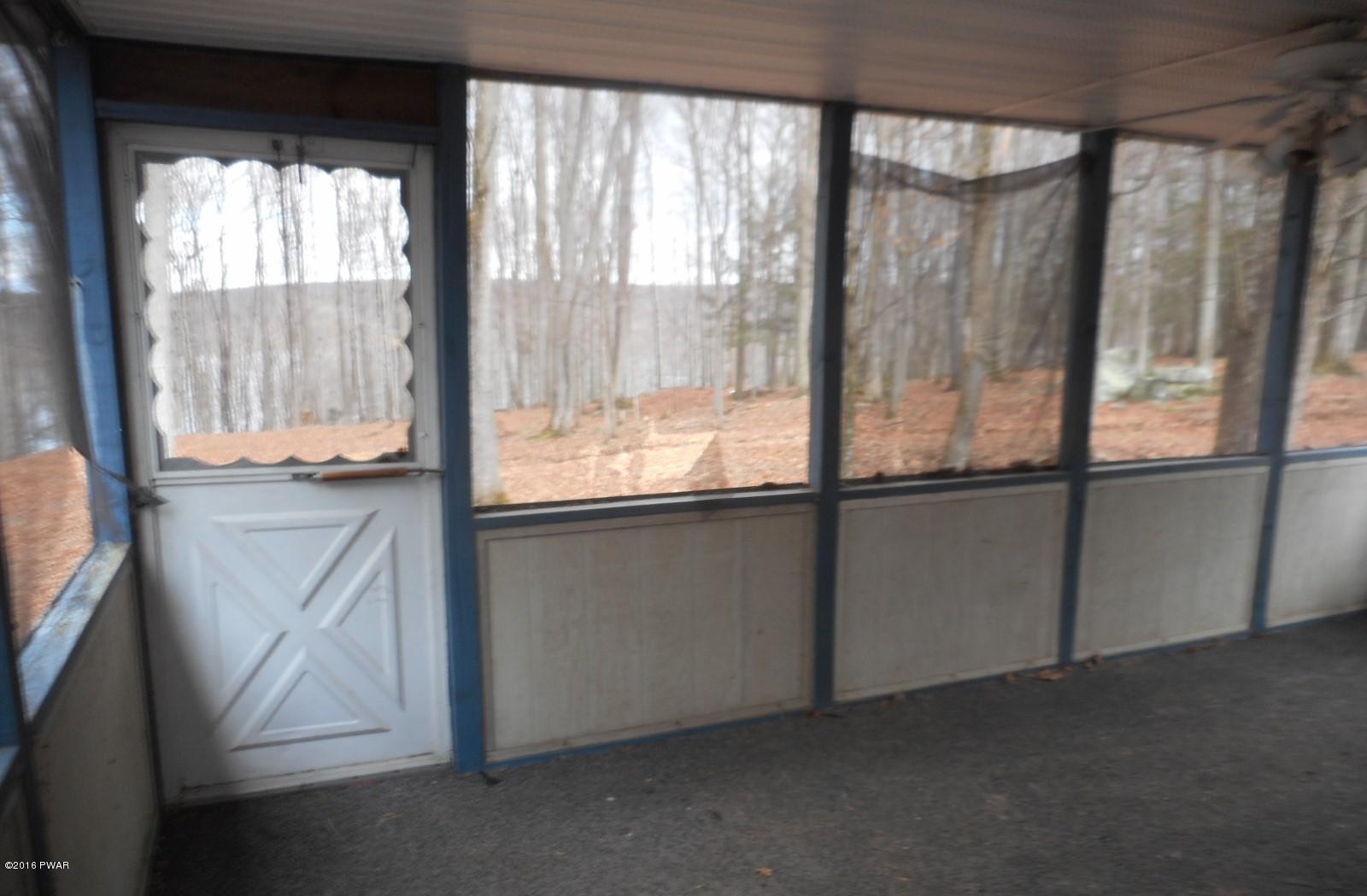 544 Hummingbird Lane Hawley, PA 18428 - Photo 15 of 16 a view of an empty room with a window