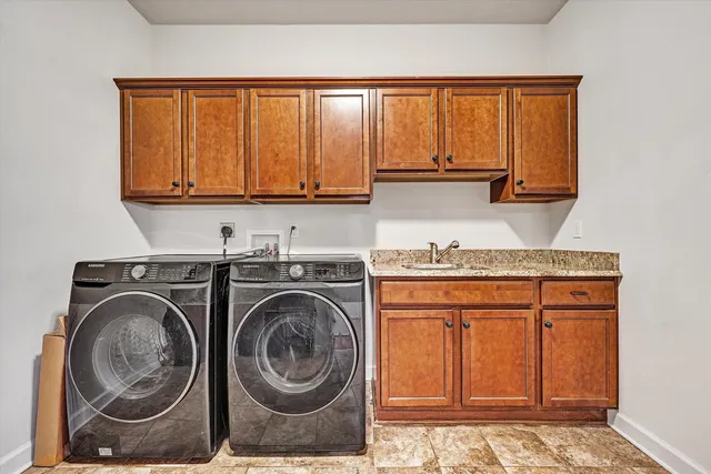an empty room with wooden floor and ceiling fan