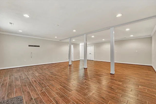 a view of a room with wooden walls