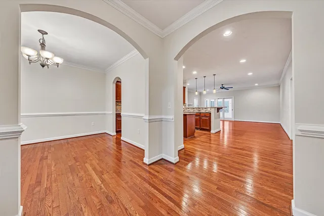 a kitchen with stainless steel appliances granite countertop wooden cabinets and a counter top space