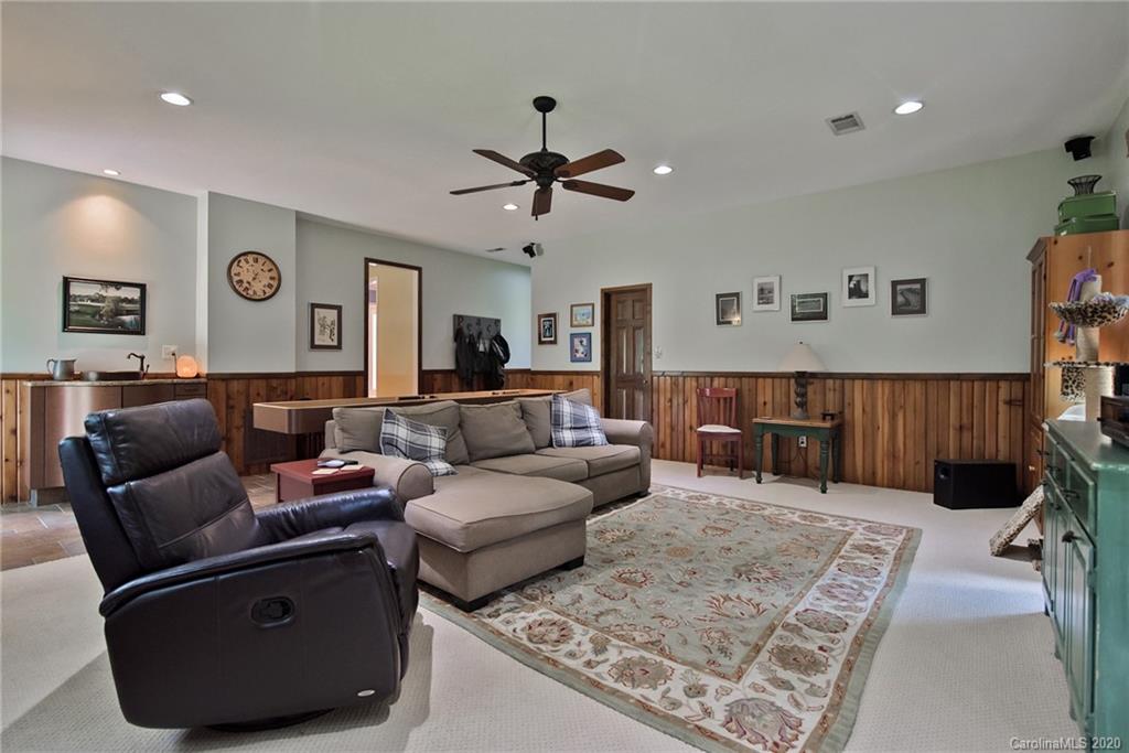 8079 Fairfield Forest Road Denver, NC 28037 - Photo 14 of 40 a living room with furniture and a rug