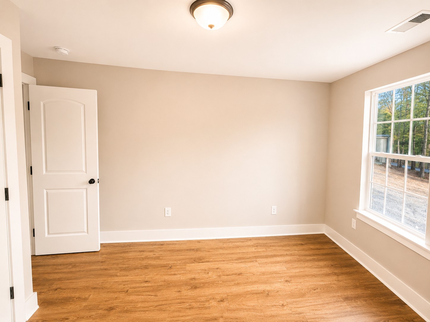 4603 Chapel Hill Road Southside, TN 37171 - Photo 21 of 26 a view of an empty room with wooden floor and a window