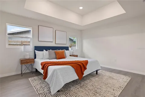 a bedroom with bed and window