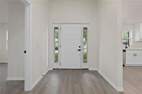 an empty room with closet and mirror