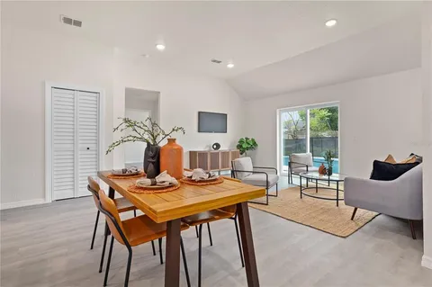 a living room with furniture and a table