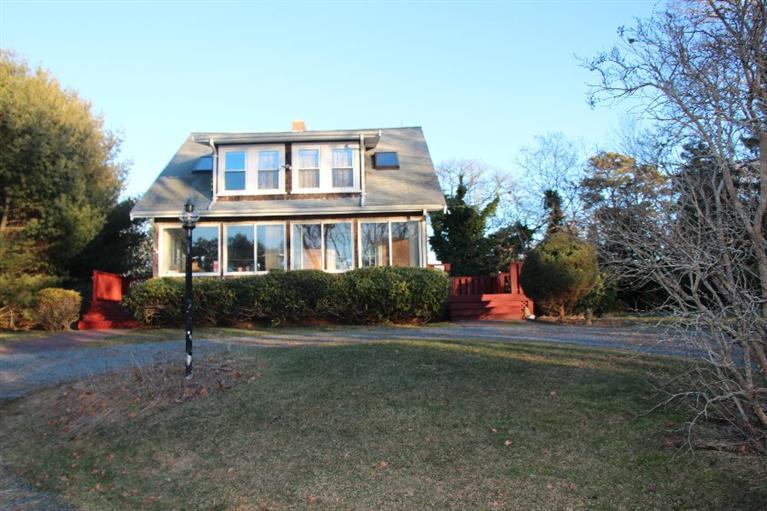 40 Carlisle Road Bourne, MA 02532 - Photo 1 of 28 a front view of a house with a yard