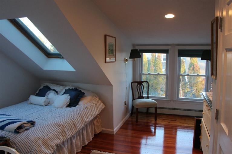 40 Carlisle Road Bourne, MA 02532 - Photo 20 of 28 a bedroom with a bed and a large window