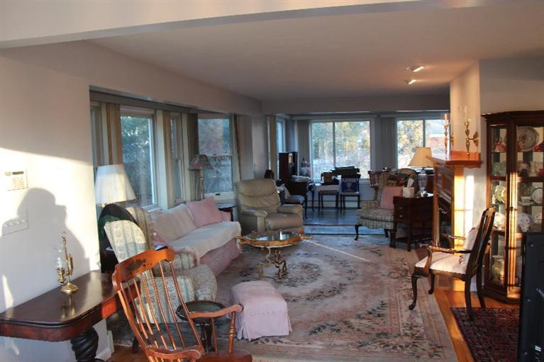 40 Carlisle Road Bourne, MA 02532 - Photo 8 of 28 a living room with furniture and large windows