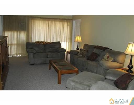 18 Cranston Road Kendall Park, NJ 08824 - Photo 13 of 25 a living room with furniture and a window