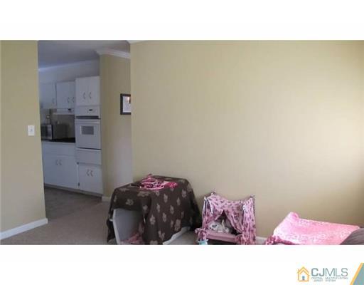 18 Cranston Road Kendall Park, NJ 08824 - Photo 15 of 25 a living room with a bed