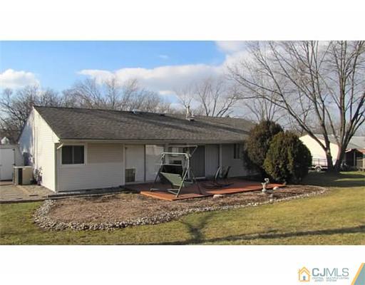 18 Cranston Road Kendall Park, NJ 08824 - Photo 22 of 25 a view of a house with backyard and trees