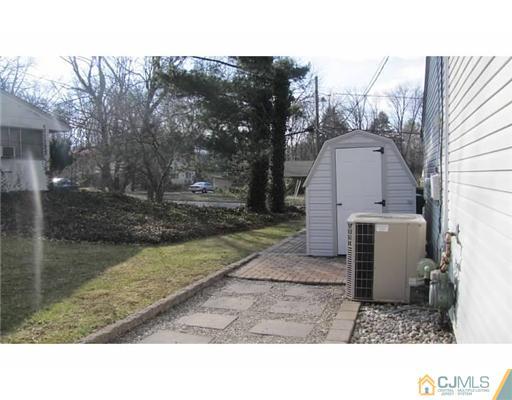 18 Cranston Road Kendall Park, NJ 08824 - Photo 24 of 25 a black and white photo of a house