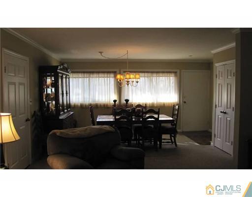 18 Cranston Road Kendall Park, NJ 08824 - Photo 9 of 25 a living room with furniture and a large window