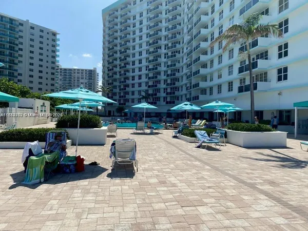 a dining room with a table and chairs