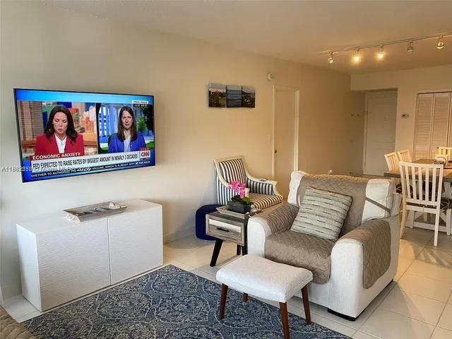 a kitchen with a sink a stove a microwave and cabinets