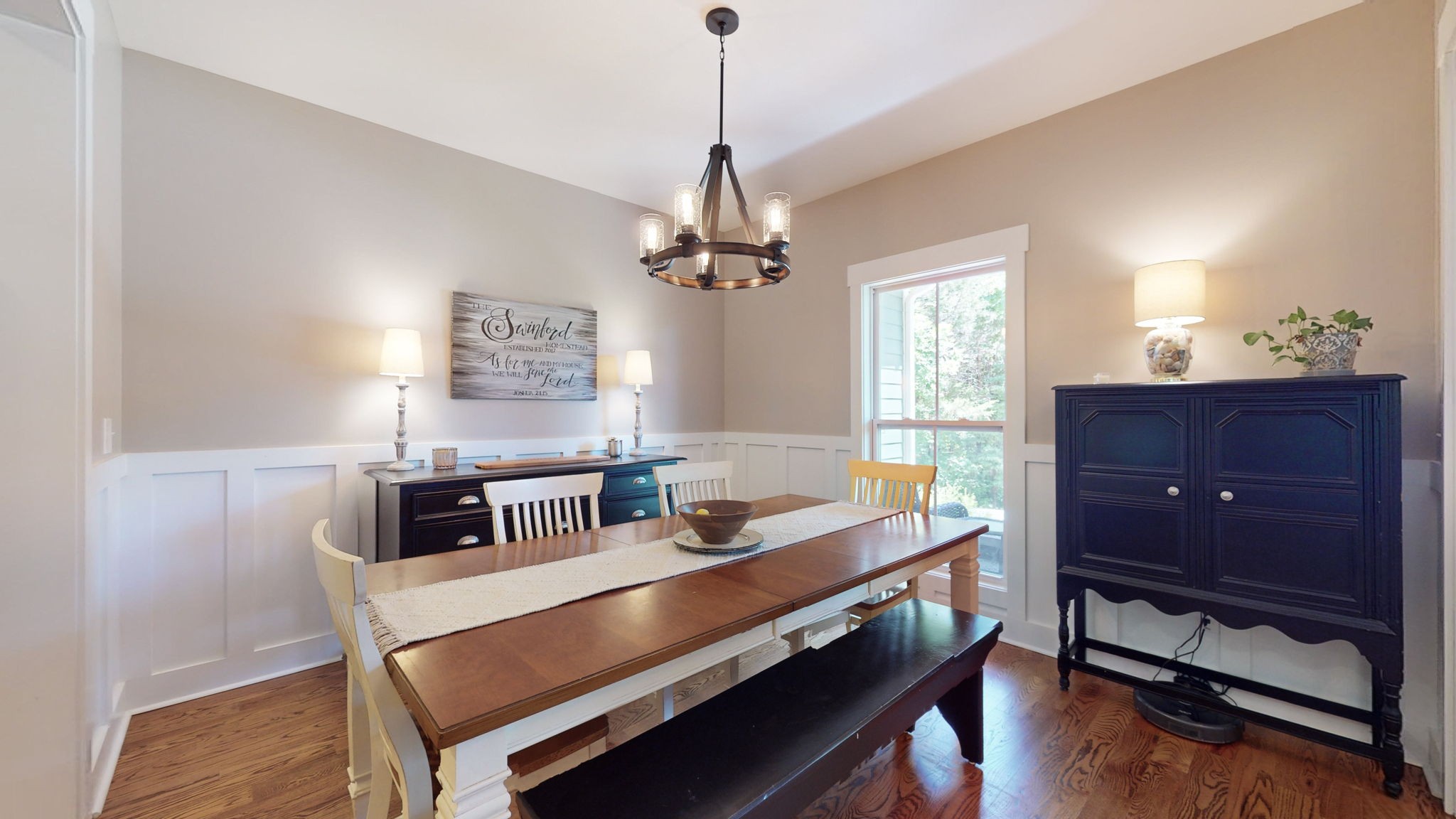 4852 Ash Hill Road Spring Hill, TN 37174 - Photo 12 of 60 a room with a table chairs and wooden floor