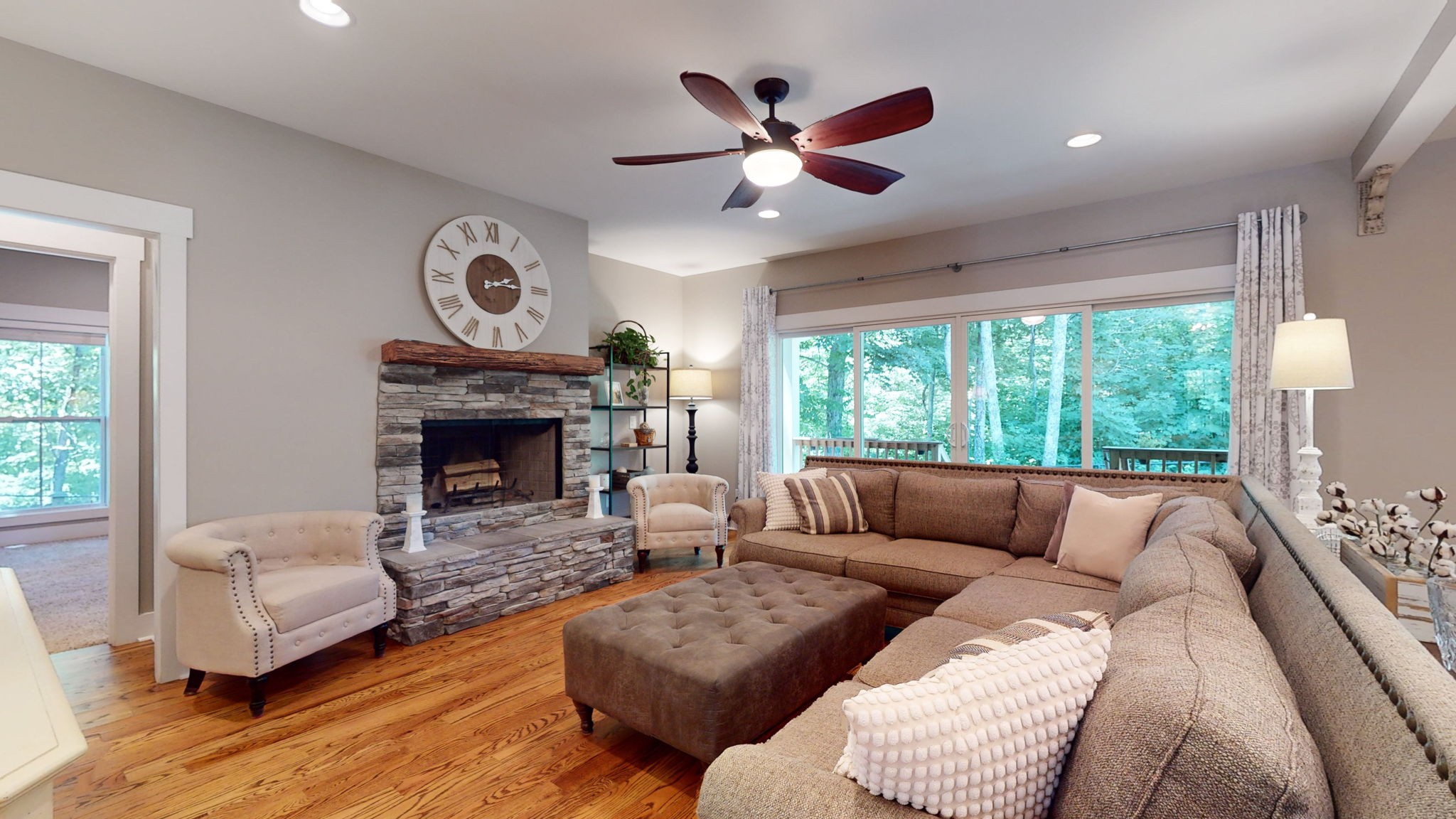 4852 Ash Hill Road Spring Hill, TN 37174 - Photo 15 of 60 a living room with furniture and a fireplace
