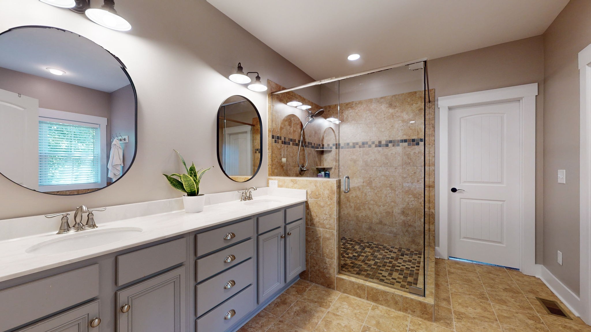 4852 Ash Hill Road Spring Hill, TN 37174 - Photo 19 of 60 a bathroom with a double vanity sink and a mirror