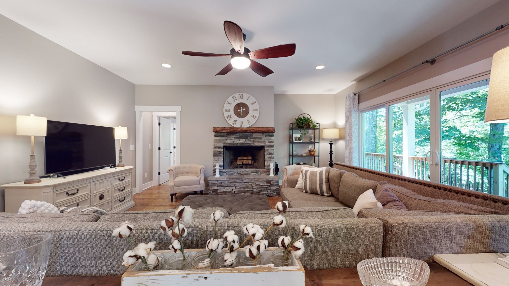 4852 Ash Hill Road Spring Hill, TN 37174 - Photo 23 of 60 a living room with furniture a flat screen tv and a large window