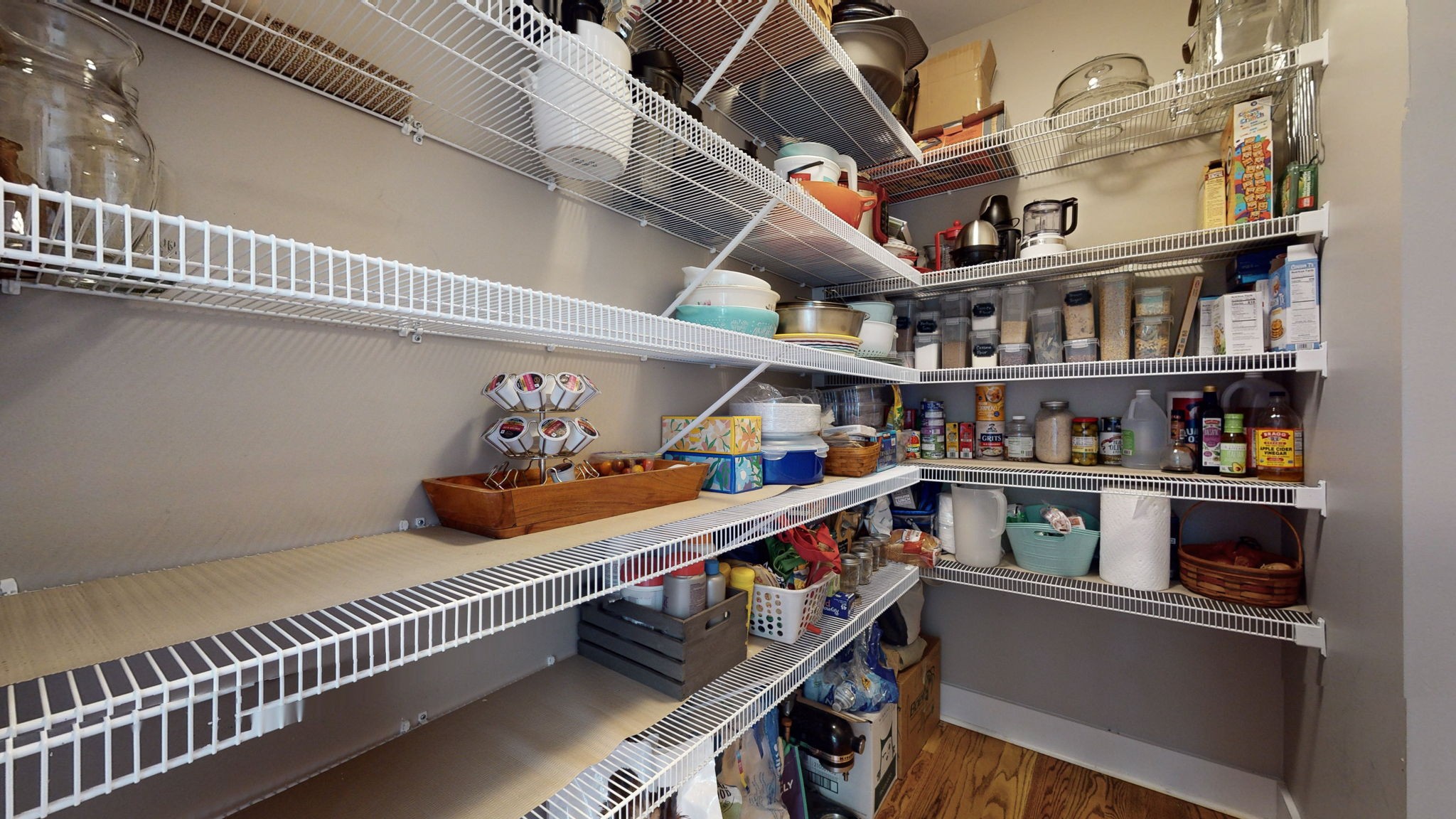 4852 Ash Hill Road Spring Hill, TN 37174 - Photo 27 of 60 a room with lots of books and a refrigerator