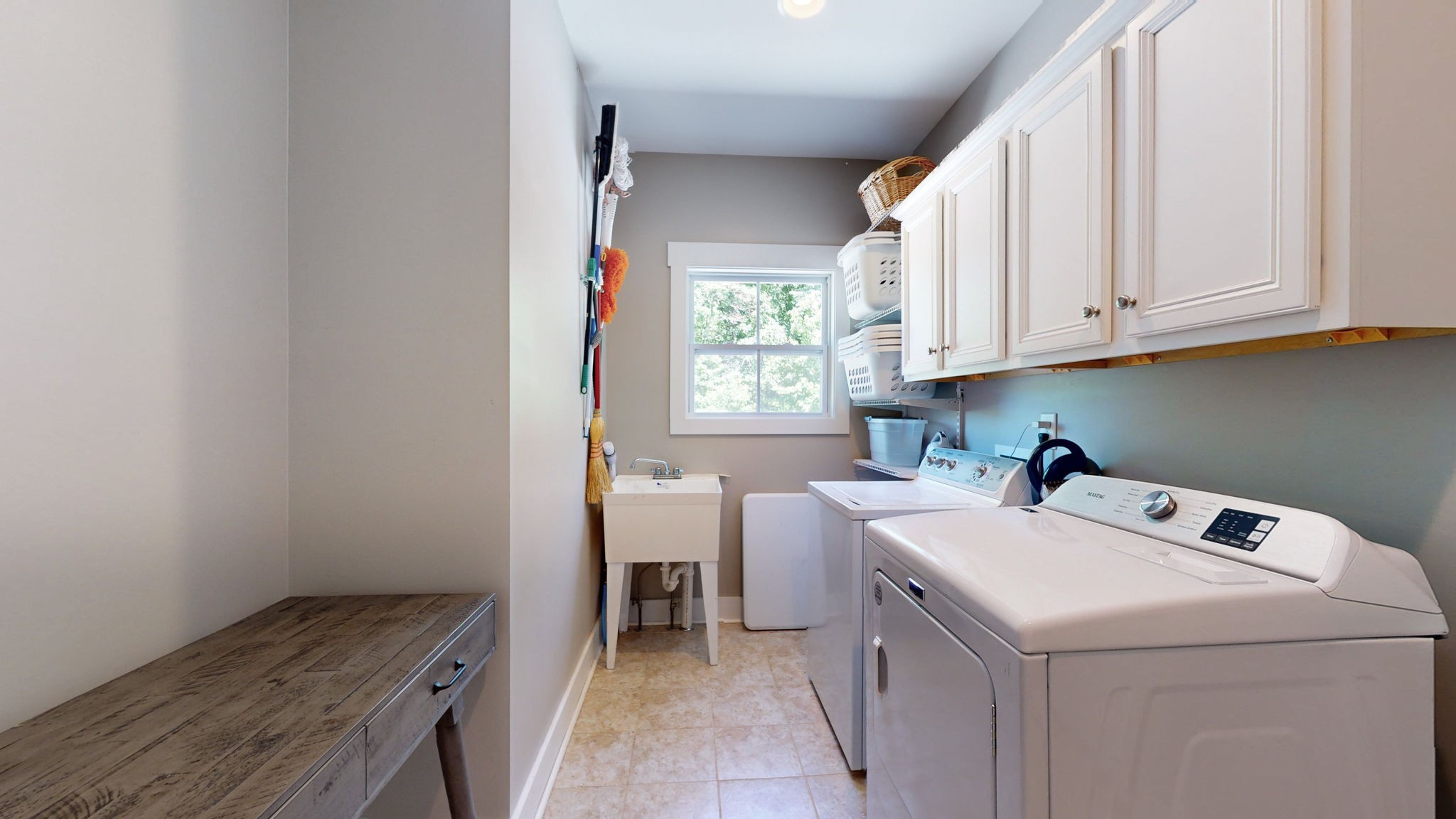4852 Ash Hill Road Spring Hill, TN 37174 - Photo 28 of 60 a view of storage and utility room with washer and dryer