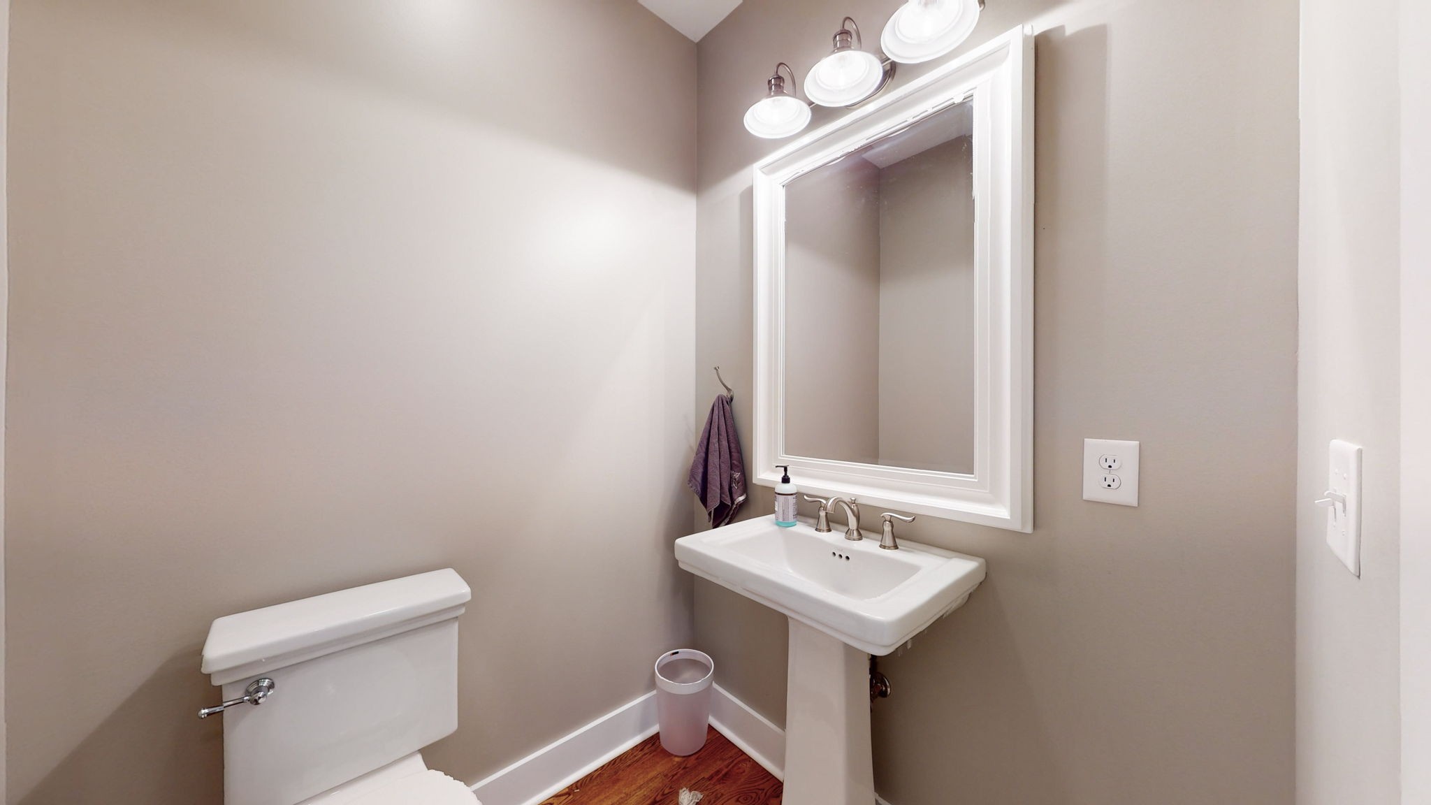 4852 Ash Hill Road Spring Hill, TN 37174 - Photo 29 of 60 a bathroom with a sink a light fixture and a toilet