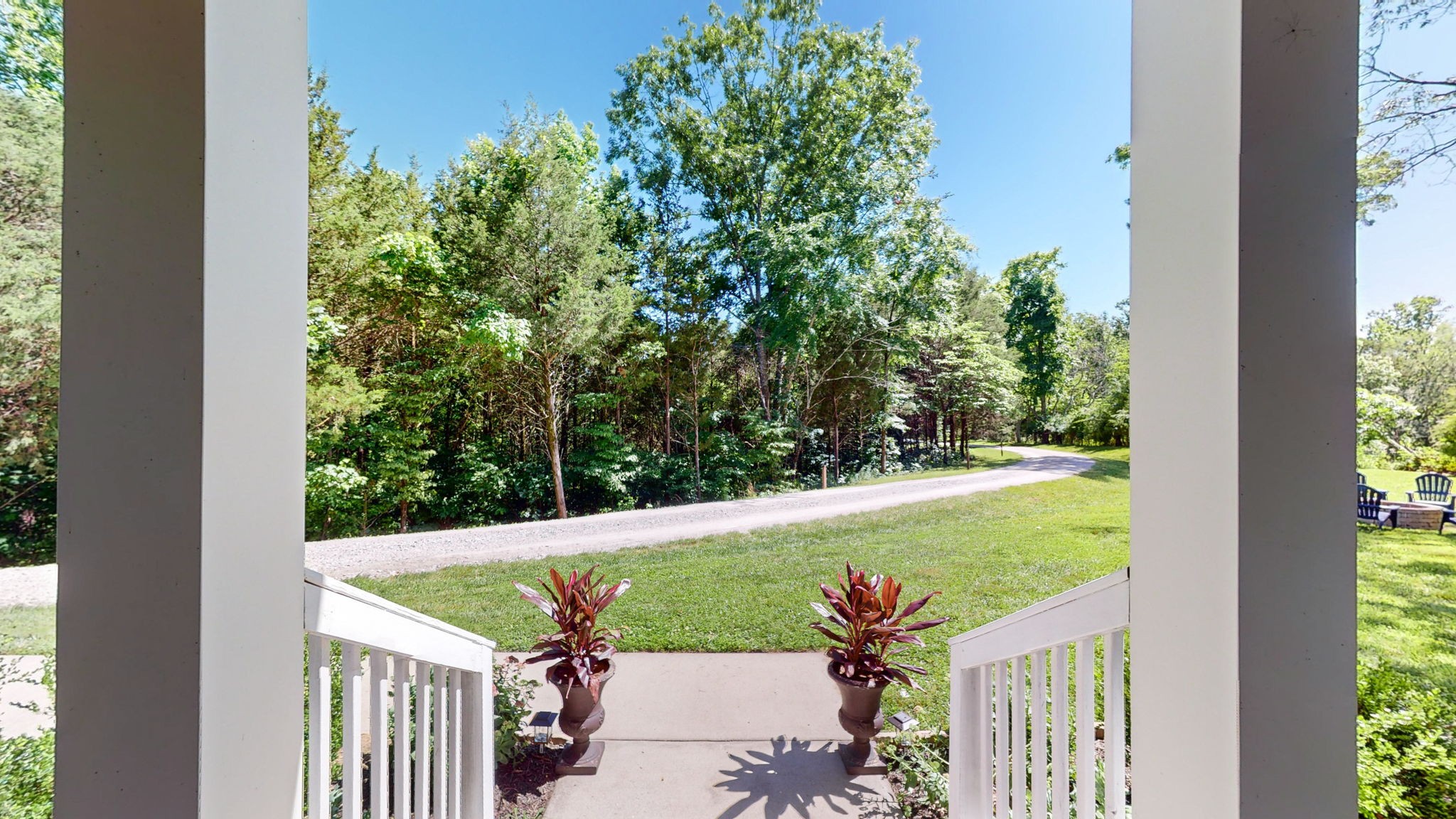 4852 Ash Hill Road Spring Hill, TN 37174 - Photo 45 of 60 a view of a backyard with plants and large tree