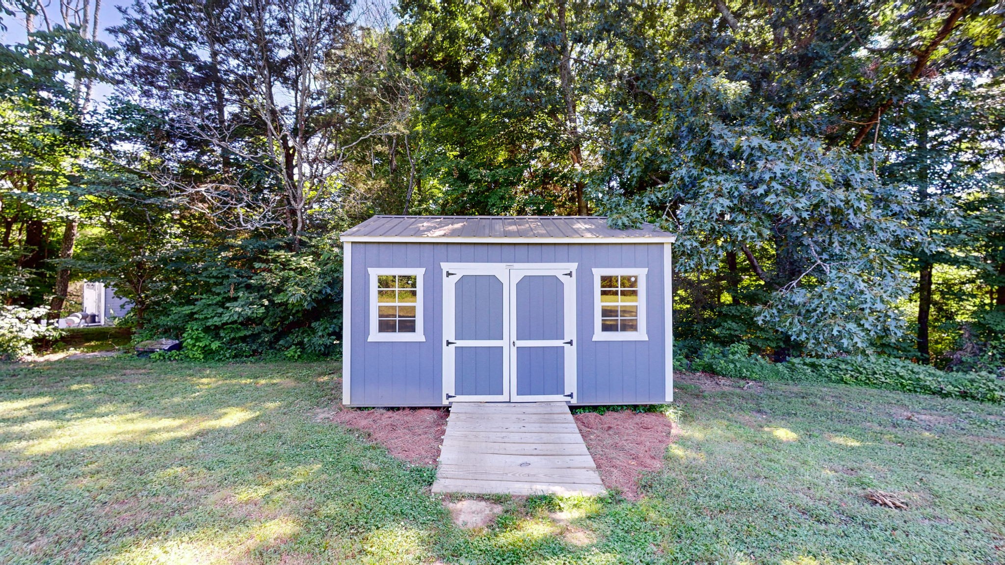 4852 Ash Hill Road Spring Hill, TN 37174 - Photo 57 of 60 a front view of a house with a yard and trees