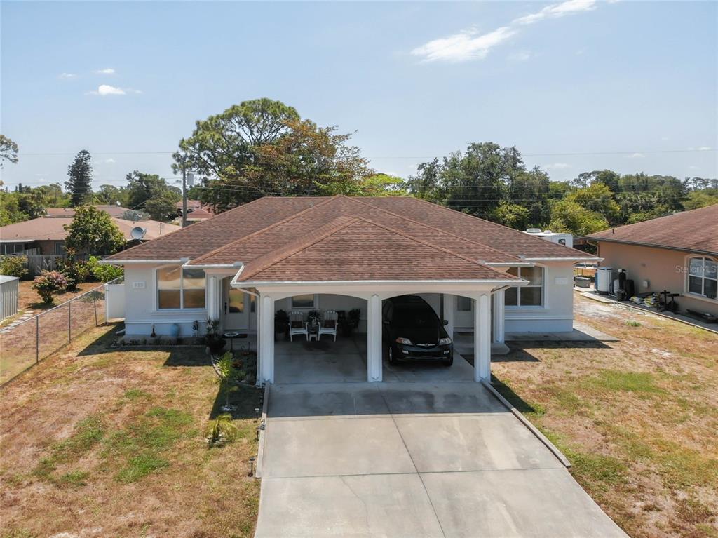 a view of a house with a yard
