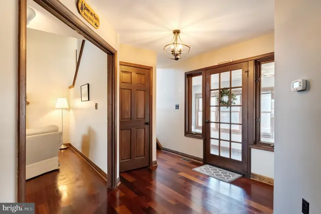 a living room with fireplace furniture and a wooden floor