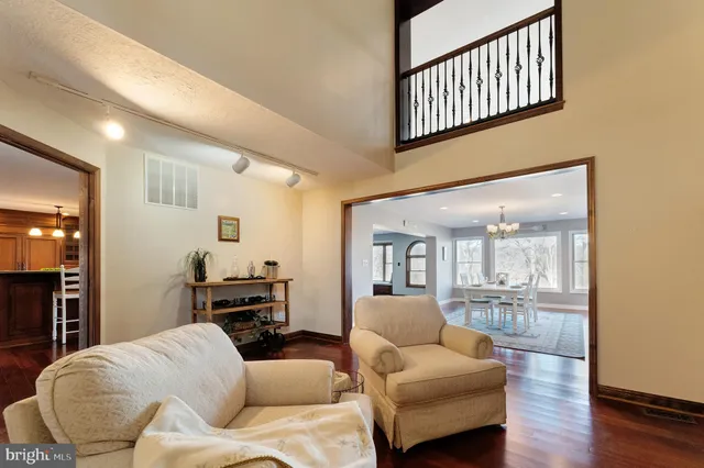 a bedroom with two beds and a large window