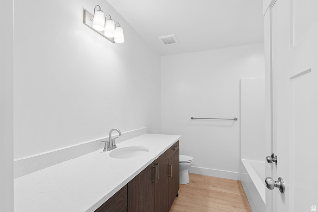 1617 North Angel Street Layton, UT 84041 - Photo 32 of 43 Full bath with vanity, light wood-style flooring, and shower / bathtub combination