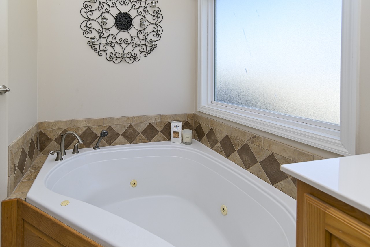 182 Old Camargo Road Fayetteville, TN 37334 - Photo 17 of 59 a bathroom with a bathtub and a window
