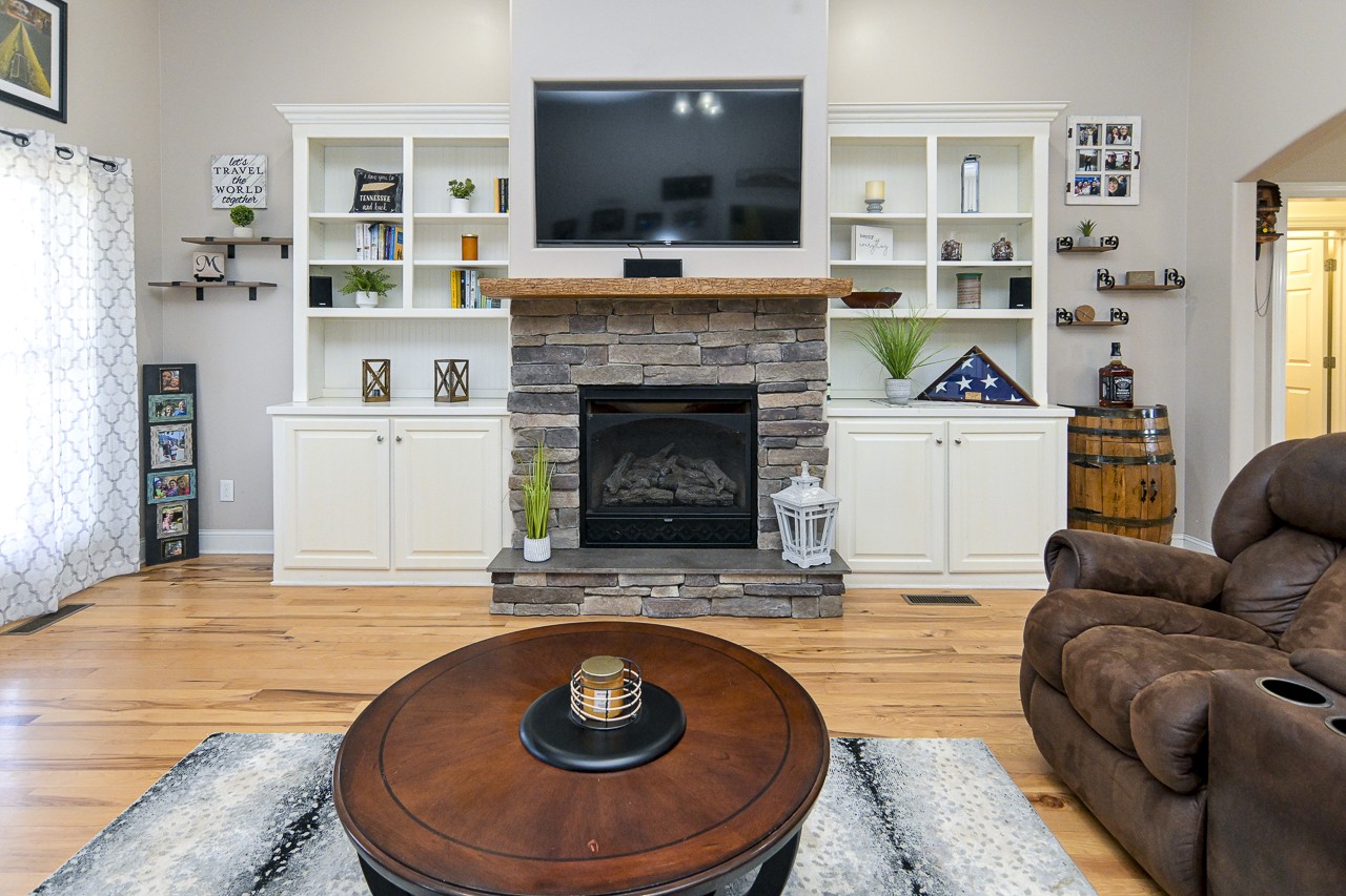 182 Old Camargo Road Fayetteville, TN 37334 - Photo 25 of 59 a living room with furniture and a fireplace