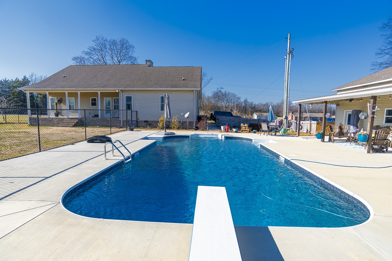 182 Old Camargo Road Fayetteville, TN 37334 - Photo 29 of 59 a swimming pool with outdoor seating and yard
