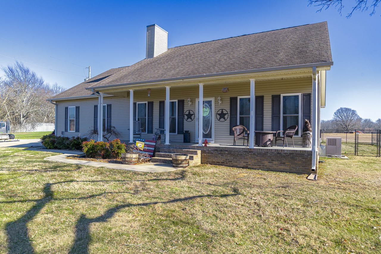 182 Old Camargo Road Fayetteville, TN 37334 - Photo 58 of 59 a view of a house with patio outdoor dining space and a patio