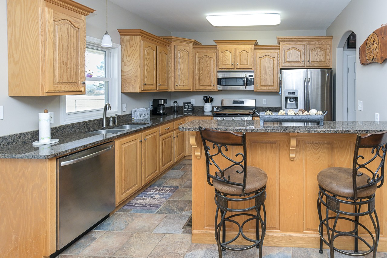 182 Old Camargo Road Fayetteville, TN 37334 - Photo 7 of 59 a kitchen with stainless steel appliances granite countertop a stove a sink and a microwave