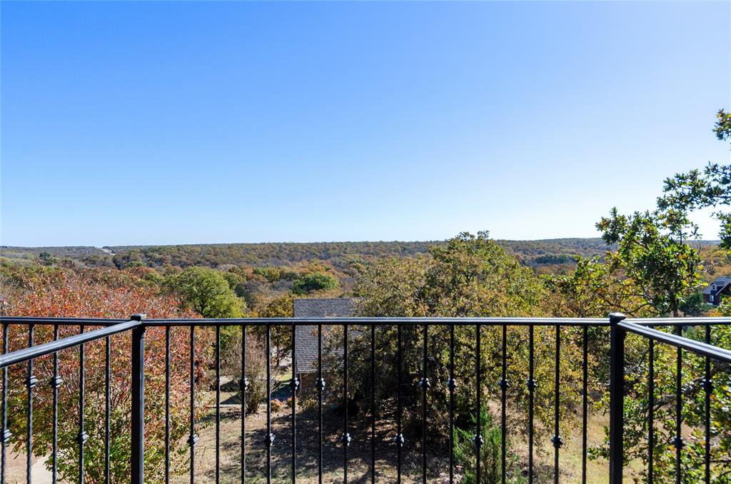 396 Ranchview Court Bowie, TX 76230 - Photo 12 of 38 a view of a balcony with wooden floor and fence