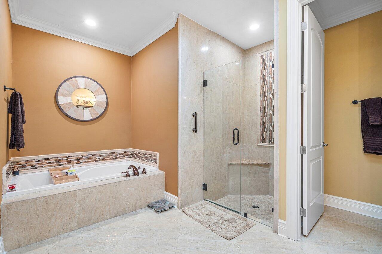 6052 Terra Mere Circle Boynton Beach, FL 33437 - Photo 26 of 52 a bathroom with a tub and a window